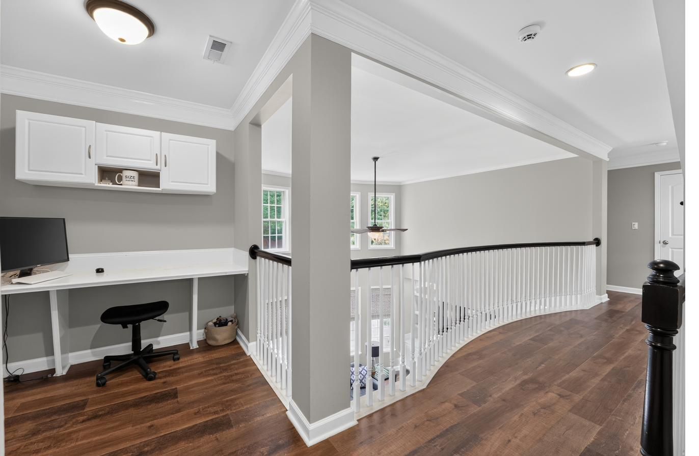Curved balcony overlooking the great room
