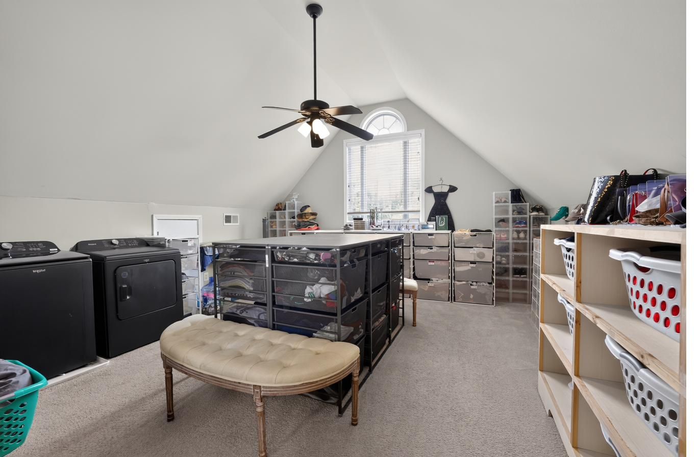Massive walk-in closet with private washer and dryer