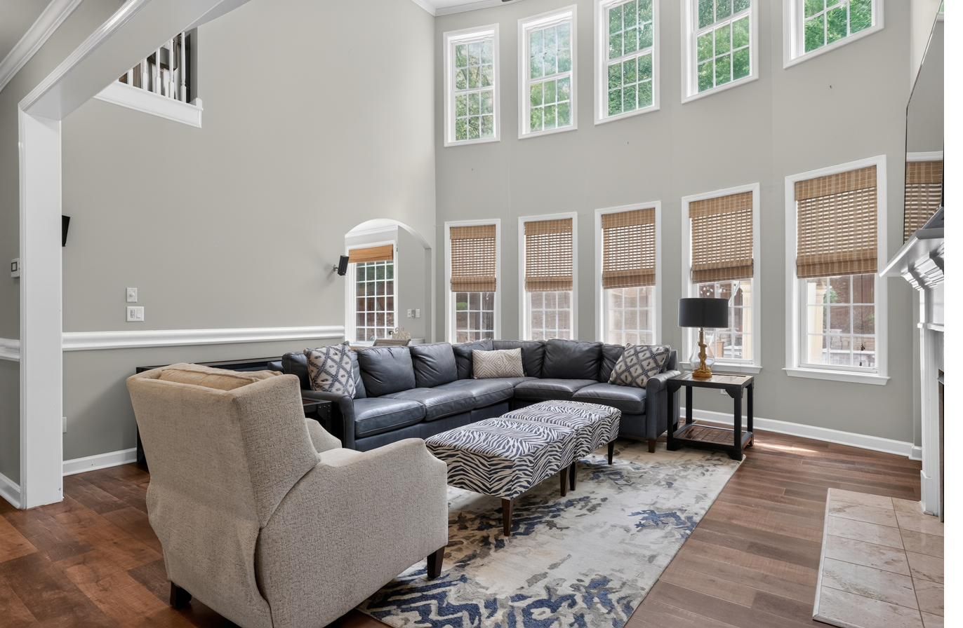 Two-story great room with curved balcony overlook