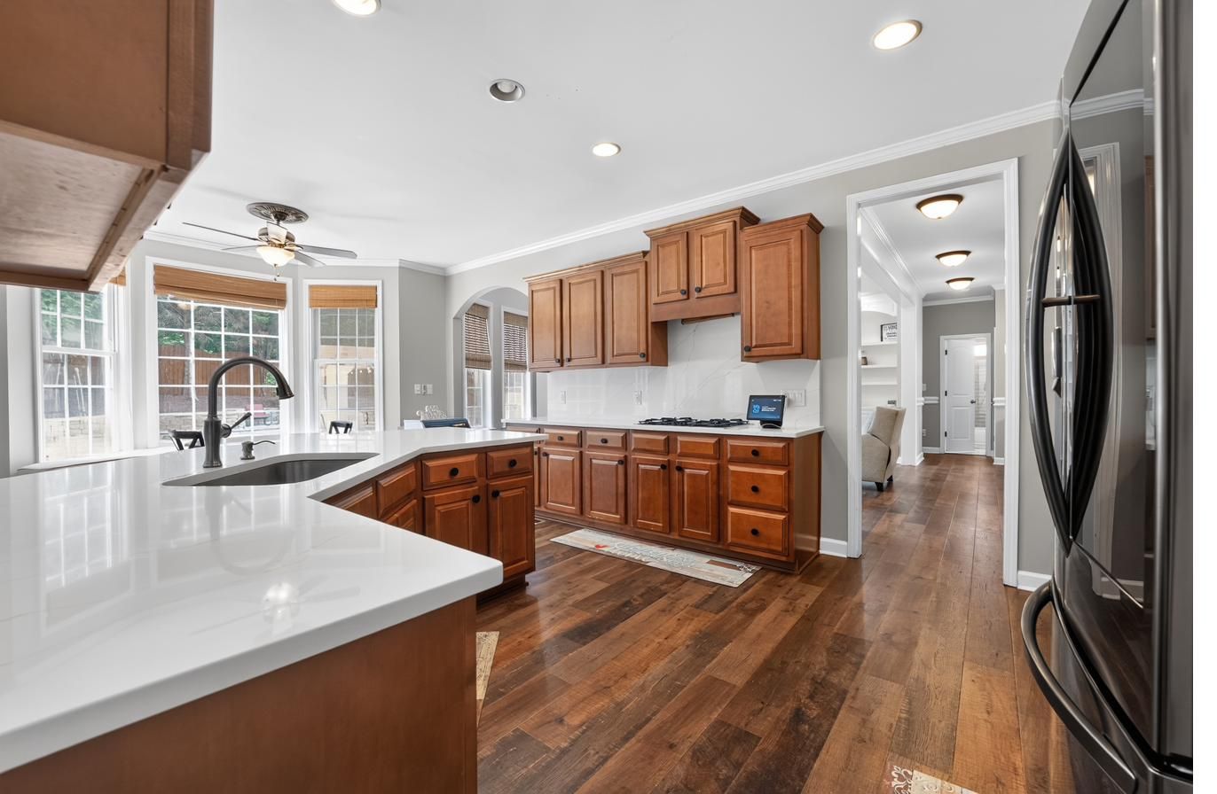 Chef's kitchen with quartz counters and large island